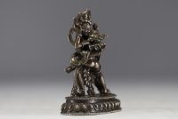 China - Tibet - Silver statue of Vajrapani embracing Shakti.