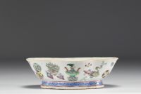 China - Famille rose polychrome porcelain bowl decorated with furniture, circa 1920.