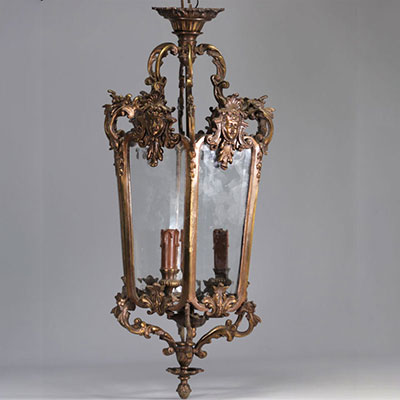 Bronze hall lantern decorated with women's heads in mascarons