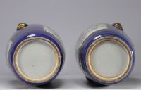 Large pair of blue powdered porcelain vases decorated with scenes of life from the 19th century