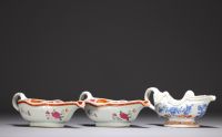 China - Set of three porcelain sauce boats, one blue white and two famille rose, 18th century.