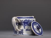 China - A white and blue porcelain teapot decorated with landscapes and a junk, 18th century.