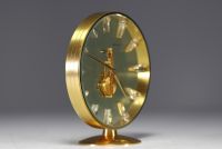 Jaeger-LeCoultre - Glass and brass ‘Squelette’ table clock, 8-day baguette movement, circa 1960.