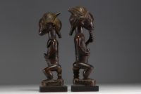 Africa - A pair of Baule wooden statues, 20th century.