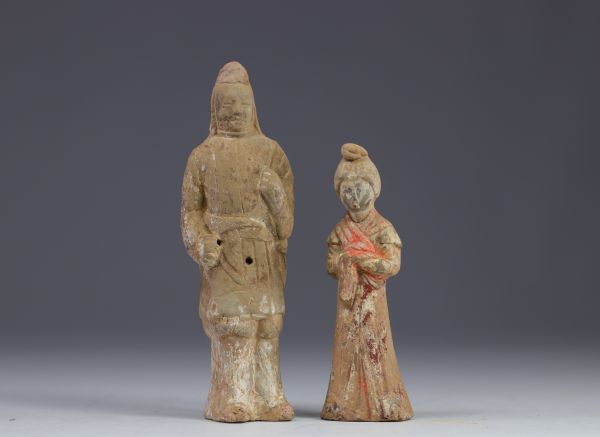 China - Two polychrome terracotta statues in the form of figures, from the Tang period (618-907).