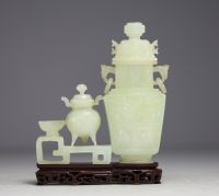 China - Jadeite sculpture representing two covered pots on a wooden base.