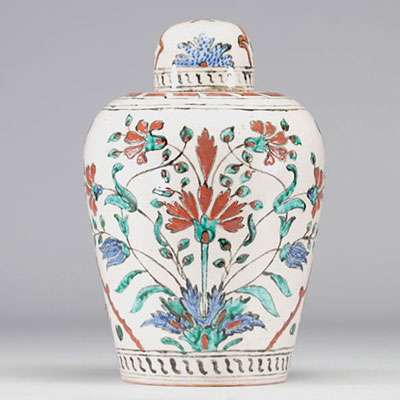 Ottoman Iznik style vase decorated with floral motifs and traditional Ottoman floral arches and borders