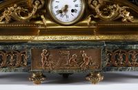 Imposing ormolu and patinated mantel clock decorated with antique figures, marble base, 19th century.