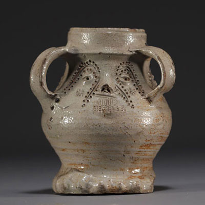 Raeren - Rare stoneware jug decorated with faces, salt glaze, early 16th century.