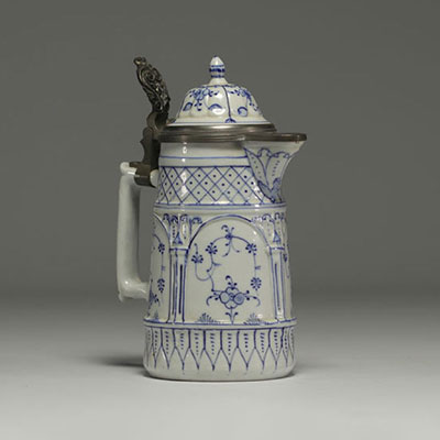 Rauenstein porcelain jug with white and blue decoration, pewter frame, 19th century.