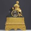 Gilt and patinated bronze clock decorated with Young Girl with Flower Basket, striking movement, Empire period.