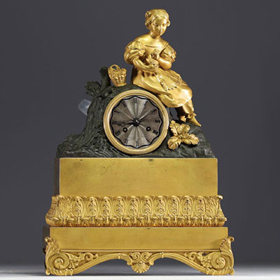 Gilt and patinated bronze clock decorated with Young Girl with Flower Basket, striking movement, Empire period.