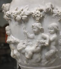 Imposing Carrara marble urn decorated with Satyrs and Putti in the Clodion style, first half of the 18th century.