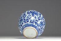China - A white-blue porcelain vase with floral decoration, 19th-20th century.