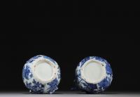 China - Pair of blue-white porcelain jugs with floral decoration, Wanli, Ming dynasty.
