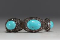 China - Solid openwork silver bracelet with two large turquoise stones.