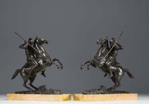 Pair of equestrian sculptures in bronze, figures in the antique style, on a marble base, Charles X period