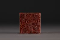 China - Carved stone seal surmounted by two lions, calligraphy, Qing period.