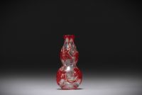 China - Snuffbox in multi-layered glass, clear background with red flowers.