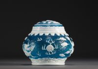 China - Peking glassware covered pot decorated with dragons and gold flakes.