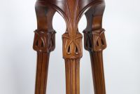 Art Nouveau harness in carved walnut with floral motif.