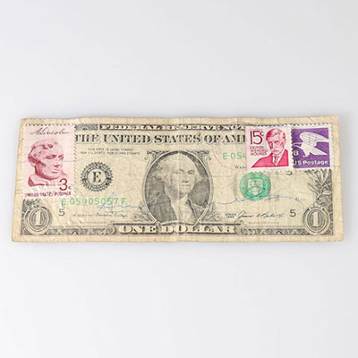 Andy Warhol - Dollar Bill, 1985 Black marker on a US dollar bill with postage stamp and ink ink indicating it has been sent it has been mailed. Signed at the