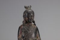 Bronze statue of a traditional figure with dark patinas and traces of gilding from Ming period China (明朝)