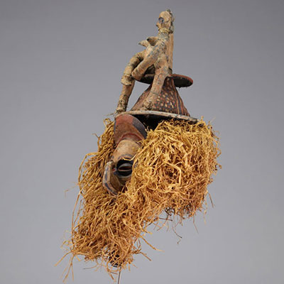 Yaka mask decorated with a figure from the 1940s from the Democratic Republic of Congo