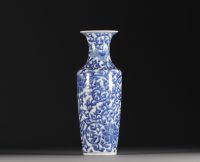 China - A white-blue porcelain baluster vase decorated with lotus flowers, double circle mark, Qing period.