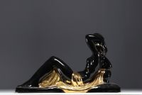 Charles LEMANCEAU ‘Reclining Woman’ Art Deco sculpture in black and gold ceramic.