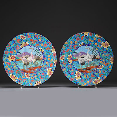 Longwy - Pair of large enameled plates decorated with cranes.