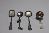 Asia - Set of four silver spoons decorated with bamboo and flowers.