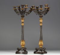 Pair of ormolu and patinated candelabras with four arms and a central covered light, tripod base, Charles X period.