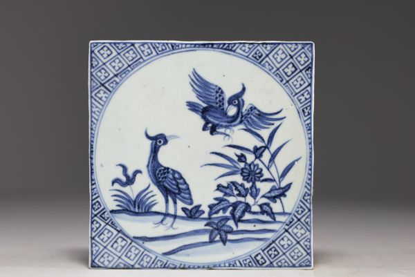 China - A blue-white porcelain floor tile decorated with birds from the 18th century.