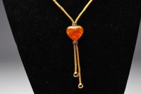 Yves SAINT LAURENT - Heart and drop necklace in imitation amber and gold-plated metal, signed.