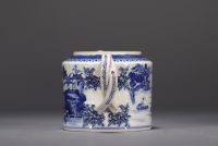 China - A white and blue porcelain teapot decorated with landscapes and a junk, 18th century.