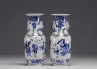 China - Pair of blue-white porcelain vases with figures, Kangxi mark, 19th century.