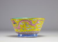 A Famille Rose porcelain bowl decorated with imperial red dragons on a yellow ground with the mark and of the Tao Kuang period (1821-1850)