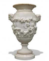 Imposing Carrara marble urn decorated with Satyrs and Putti in the Clodion style, first half of the 18th century.