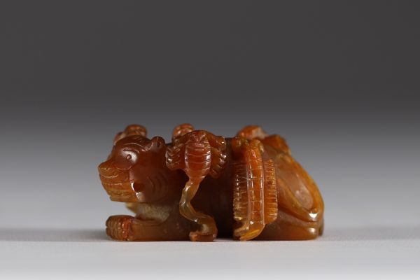 China - Amber jade sculpture representing a tiger and insects.