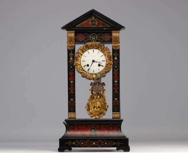 Clock in blackened wood and Boule marquetry from Napoleon III period, 19th century.