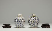 China - Pair of white-blue porcelain covered pots with children, wooden base.