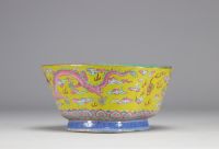 A Famille Rose porcelain bowl decorated with imperial red dragons on a yellow ground with the mark and of the Tao Kuang period (1821-1850)