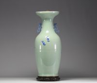 China - Large celadon porcelain vase with relief decoration of figures and bats, 19th century.