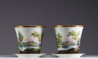 A set of two planters and an herbal tea pot in Brussels porcelain, 19th century.