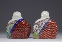 China - pair of Buddha in famille rose porcelain.