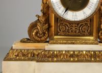 Imposing Louis XVI ormolu and white marble clock and candelabra.