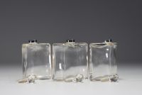 Three glass perfume bottles with silver mountings in the Empire style.