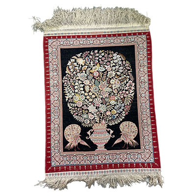 Rare silk prayer rug decorated with a flowering vase and two peacocks