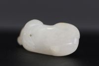 China - Small white jade pendant representing a cat, 18th century.